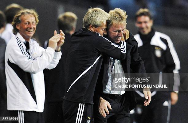 Coach of Germany's Under 21 football team Horst Hrubesch gets a hug at the end of their Under 21 European Championship final soccer against England...