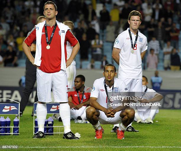 English players Andrew Taylor, Theo Walcott and Michael Mancienne are pictured after losing the Under 21 European Championship final to Germany at...