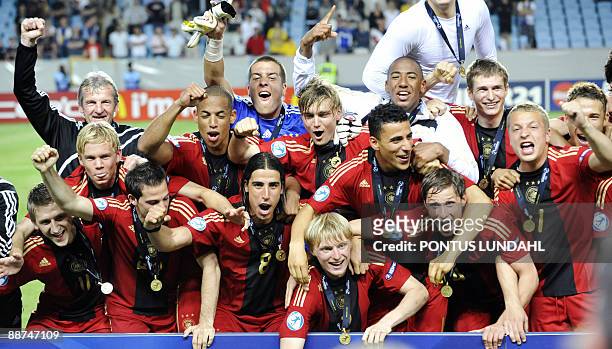 Germany players celebrate with the trophy their victory over England in the Under 21 European Championship final at the Malmo New Stadium on June 29,...