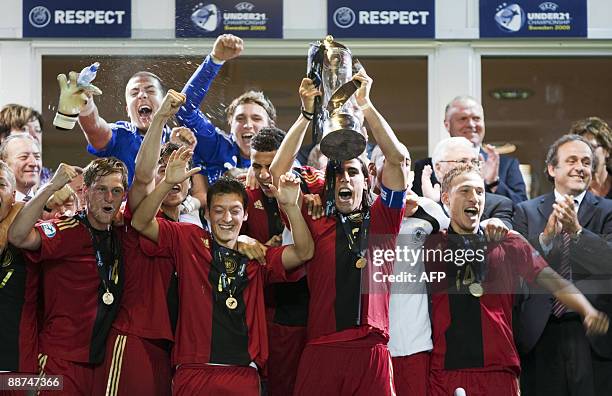 Germany's team captain Sami Khedira holds up the trophy after their victory over England in the Under 21 European Championship final at the Malmo New...