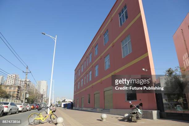 View of a trianglular building which looks as thin as just a wall from certain angles in Zhengzhou in central China's Henan province Wednesday Dec....