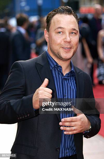 British actor Stephen Graham gestures as he arrives at London's Leicester Square on June 29 to attend the British Premiere of his latest film 'Public...