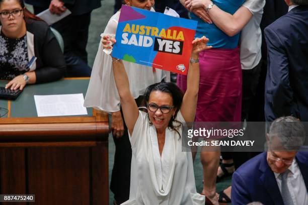 Labor Member of Parliament Linda Burney celebrates as the Australian Parliament passed the same-sex marriage bill in Canberra on December 7, 2017....