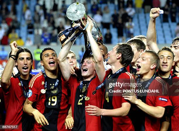 Germany players hold up the trophy after their victory over England in the Under 21 European Championship final at the Malmo New Stadium on June 29,...