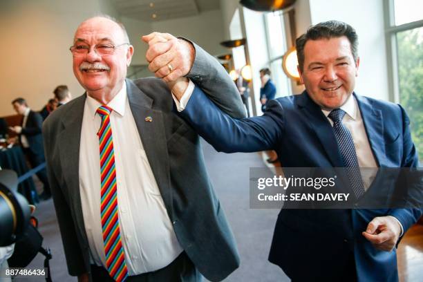 Liberal Members of Parliament Warren Entsch and Den Smith celebrate after parliament passed the same-sex marraige bill in the Federal Parliament in...