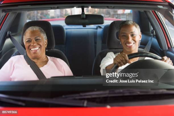 african women driving in car - driver front view stock pictures, royalty-free photos & images