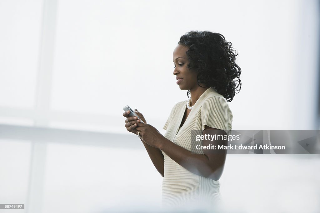African businesswoman using cell phone