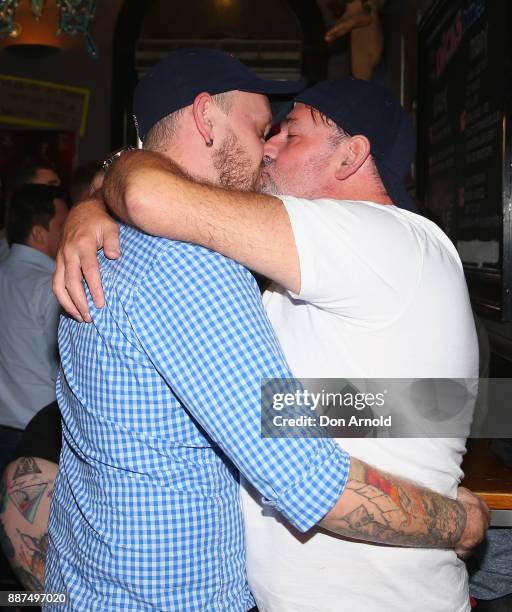 Stu Halley and Dave Gollan display their appreciation of the passing of the Gay Marriage Bill inside the Stonewall Hotel on December 7, 2017 in...