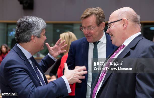 Portuguese Finance Minister Mario Centeno is talking with the Belgian Finance Minister Johan Van Overtveldt and the German Chief of Staff and acting...