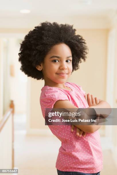 mixed race girl with arms crossed - kids standing crossed arms stock pictures, royalty-free photos & images