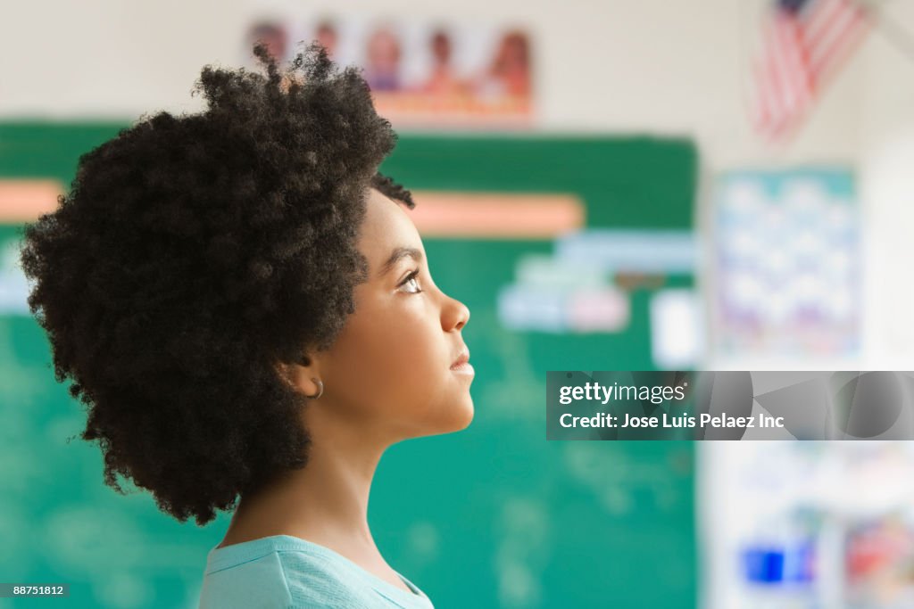 Mixed race girl in classroom