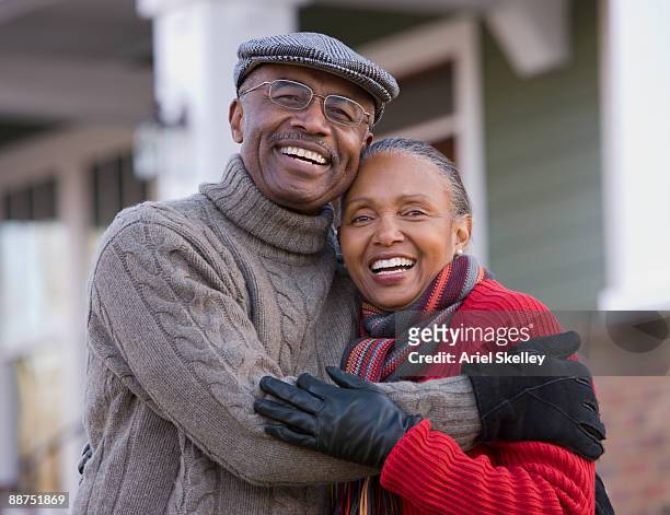 african couple hugging outdoors - old man woman christmas stockfoto's en -beelden