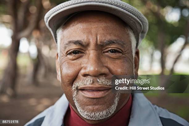 senior african man in park - goatee ストックフォトと画像