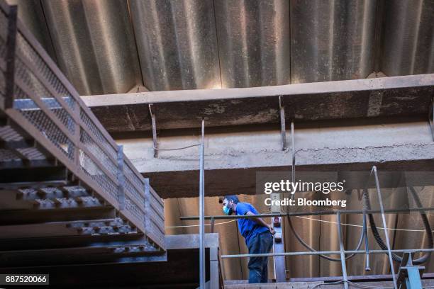 An employee works in the ball mill department at the Shabbir Tiles & Ceramics Ltd. Production facility in Karachi, Pakistan, on Wednesday, Dec. 6,...