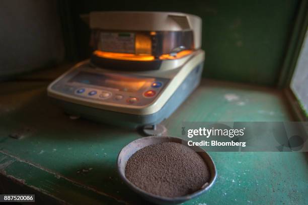Sample of dry slip powder sit next to a moisture meter at the Shabbir Tiles & Ceramics Ltd. Production facility in Karachi, Pakistan, on Wednesday,...