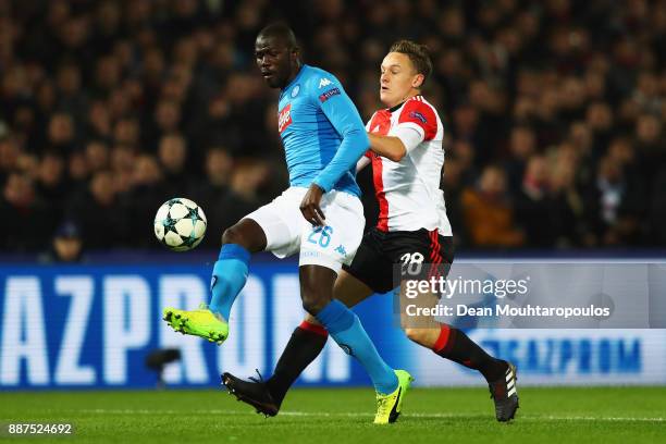 Jens Toornstra of Feyenoord battles for the ball with Kalidou Koulibaly of Napoli during the UEFA Champions League group F match between Feyenoord...