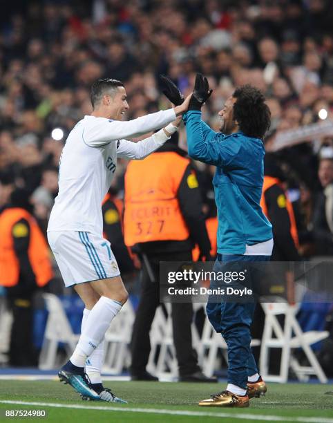 Cristiano Ronaldo of Real Madrid CF celebrates with Marcelo after scoring Real's 2nd goal during the UEFA Champions League group H match between Real...