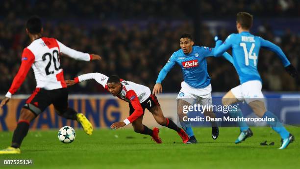 Jean-Paul Boetius of Feyenoord battles for the ball with Allan of Napoli during the UEFA Champions League group F match between Feyenoord and SSC...