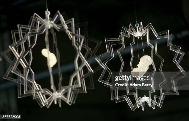 The sculpture 'Genetics' by Maryam Al Suwaidi hangs prior to the opening of the 'Art From Qatar' exhibition at Kraftwerk Berlin on December 6, 2017...