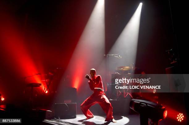South African singer Nakhane performs on stage at the Aire Libre concert hall, on December 6, 2017 in Saint-Jacques-de-la-Lande, outside Rennes, as...