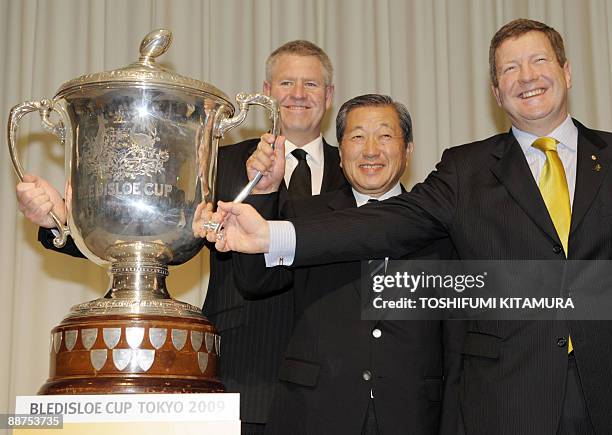 New Zealand Rugby Union CEO Steve Tew , Japan Rugby Football Union Vice President Chairman Nobby Mashimo and Australia Rugby Union Deputy Chief...