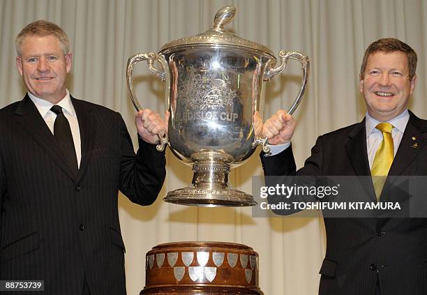 New Zealand Rugby Union CEO Steve Tew and Australia Rugby Union Deputy Chief Executive Matt Carroll hold the 9-kilogram silver Bledisloe Cup during...