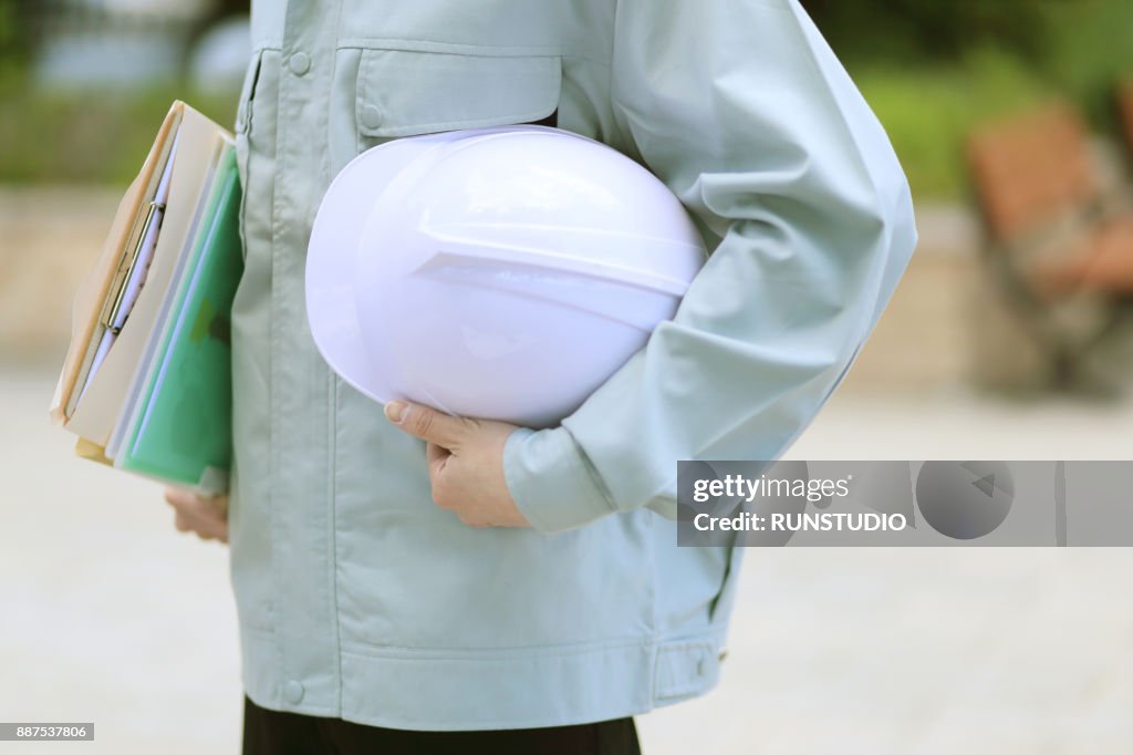 Hard File Engineering Engineer Holding Files And Hard Hat Outdoors High-Res Stock Photo ...