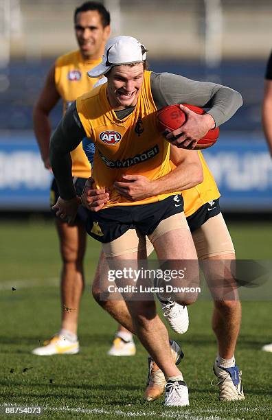 Bryce Gibbs of the Blues breaks a tackle during a Carlton Blues AFL training session at Visy Park on June 30, 2009 in Melbourne, Australia.