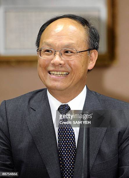 Taiwan's Deputy Finance Minister John Deng smiles during a press conference in Taipei on June 30, 2009. Taiwan partially lifted its decades-old ban...