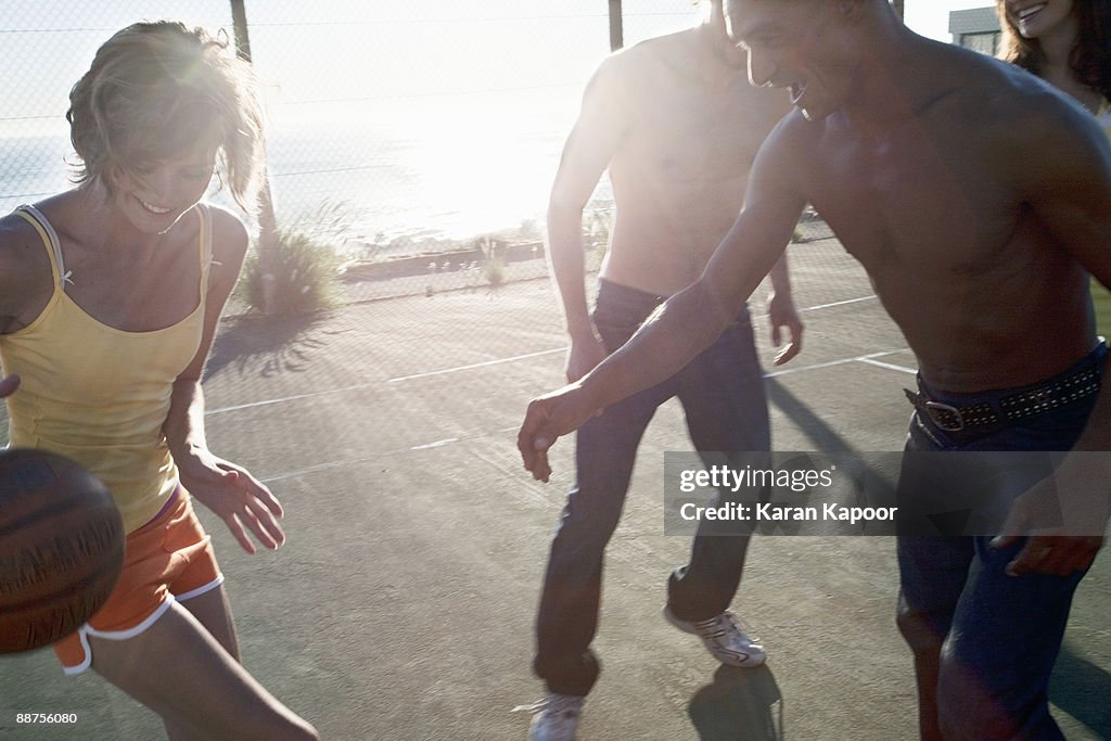 Group playing basketball