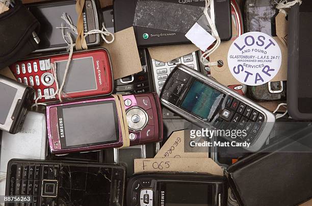 Some of the mobile phones that have been handed into the Glastonbury Festival Lost Property office at the Glastonbury Festival site at Worthy farm,...