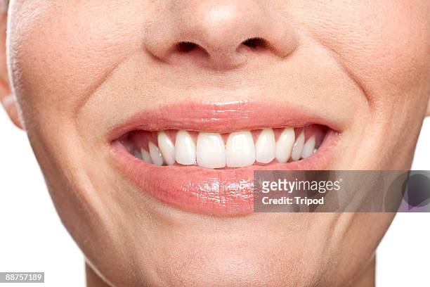 detail of woman's smile, close-up - smile close up stock-fotos und bilder