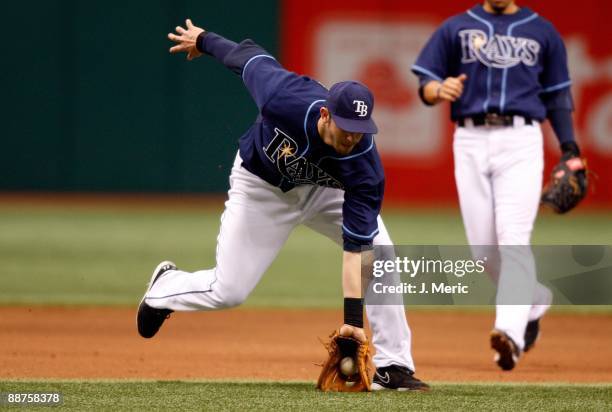 Infielder Evan Longoria of the Tampa Bay Rays fields a ground ball against the Florida Marlins during the game at Tropicana Field on June 28, 2009 in...