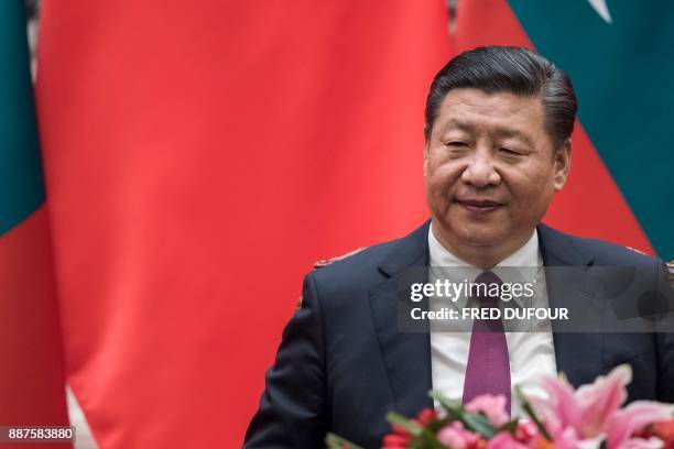 China's President Xi Jinping waits during a signing ceremony with Maldives' President Abdulla Yameen at the Great Hall of the People in Beijing on...