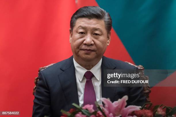 China's President Xi Jinping waits during a signing ceremony with Maldives' President Abdulla Yameen at the Great Hall of the People in Beijing on...