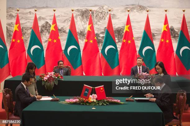 Maldives' President Abdulla Yameen attends with China's President Xi Jinping a signing ceremony at the Great Hall of the People in Beijing on...
