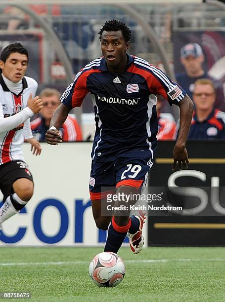 Kenny Mansally of the New England Revolution dribbles during SuperLiga Group B match against Atlas June 28 2009 at Gillette Stadium in Foxborough,...