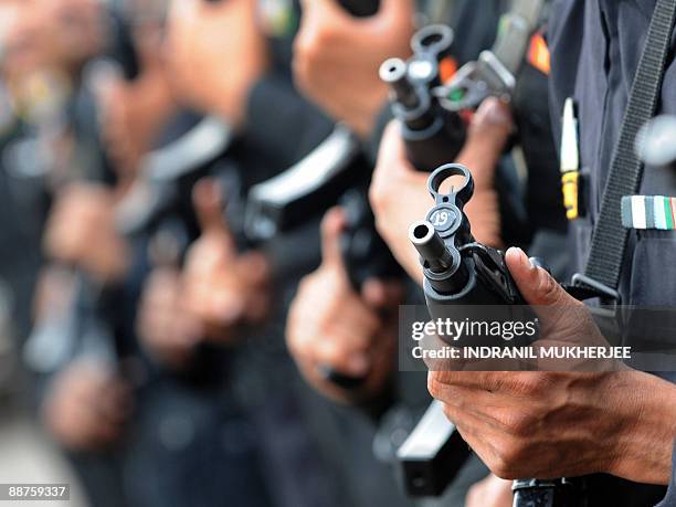 National Security Guard commandos stand in formation during the inuaguration of the NSG Mumbai Hub by Home Minister P.Chidambaram in Mumbai on June...