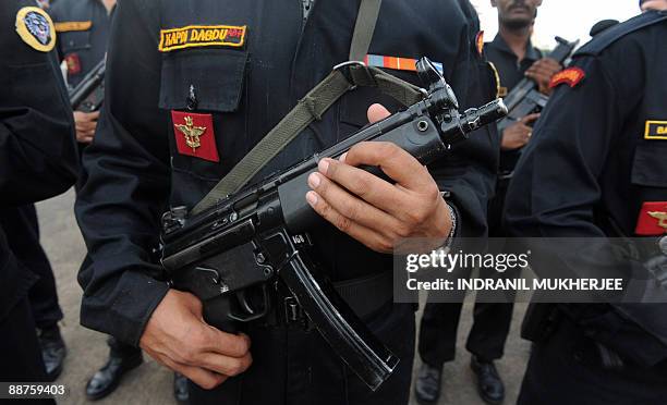 National Security Guard commandos stand in formation during the inuaguration of the NSG Mumbai Hub by Home Minister P.Chidambaram in Mumbai on June...