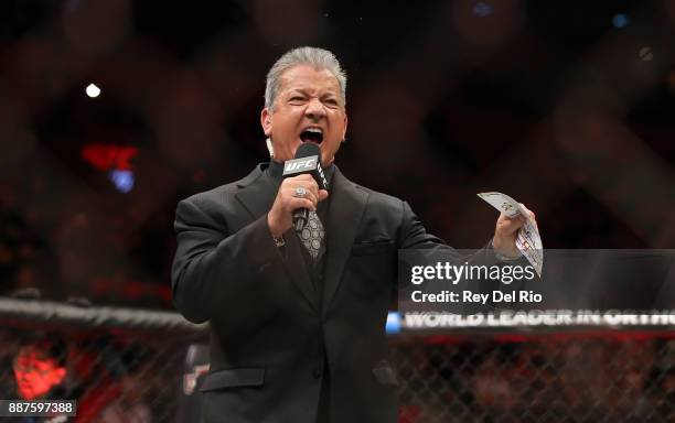 Octagon Announcer Bruce Buffer introduces Max Holloway and Jose Aldo during the UFC 218 event at Little Caesars Arena on December 2, 2017 in Detroit,...