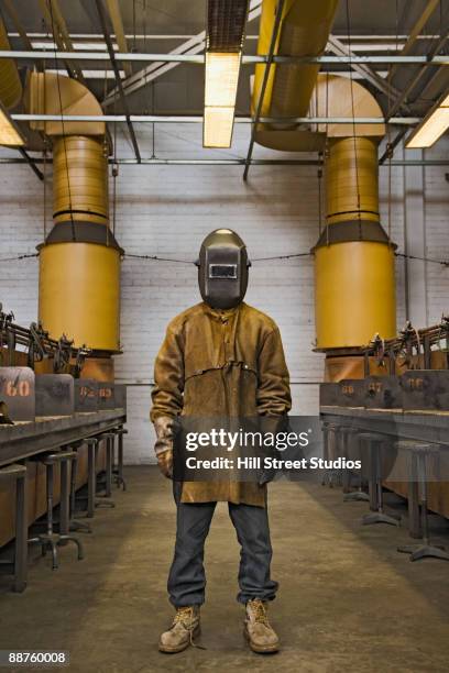 japanese welder posing in protective gear - welding mask stock pictures, royalty-free photos & images