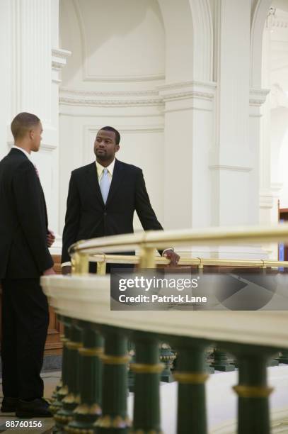 african businessmen talking near railing - black politician stock pictures, royalty-free photos & images