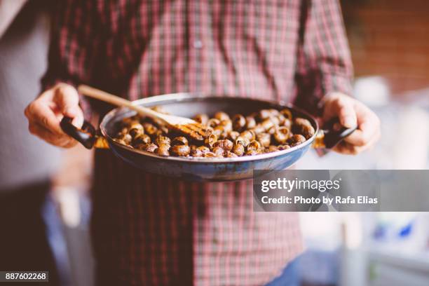 fried snails pan - lerida stock pictures, royalty-free photos & images