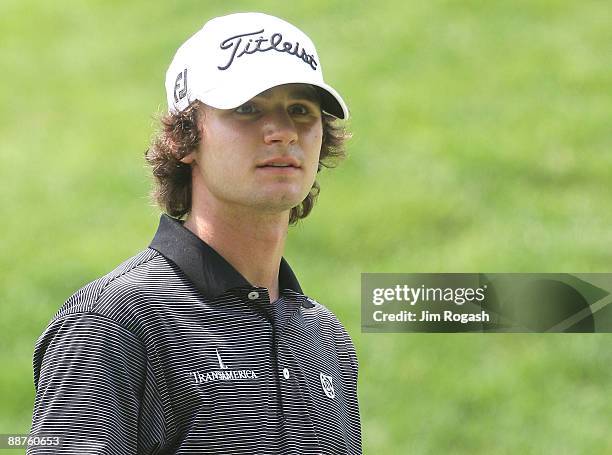 Kyle Stanley watches the action on the the 18th green during round two of the 2009 Travelers Championship at TPC River Highlands on June 26, 2009 in...