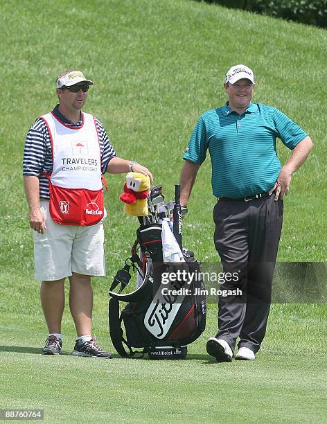 Jarrod Lyle waits to hit an approach shot during round three of the 2009 Travelers Championship at TPC River Highlands on June 27, 2009 in Cromwell,...
