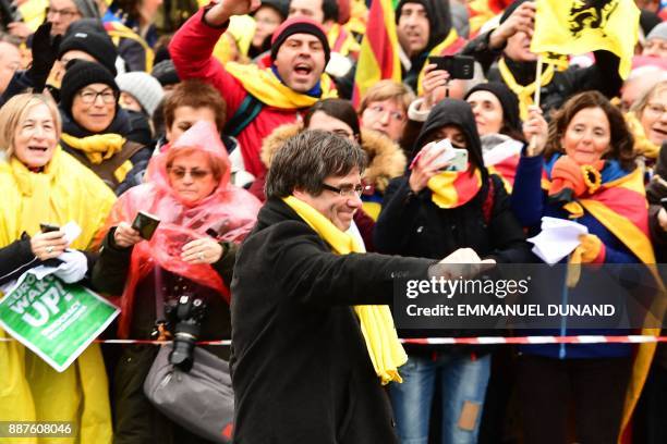 Catalonia's deposed regional president Carles Puigdemont arrives during a pro-independence demonstration on December 7, 2017 in Brussels. Organised...