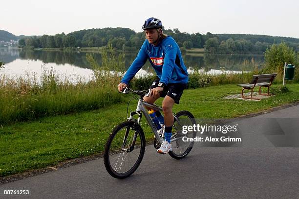 Timo Hildebrand drives his bicycle during a training camp of 1899 Hoffenheim on June 30, 2009 in Stahlhofen am Wiesensee, Germany.