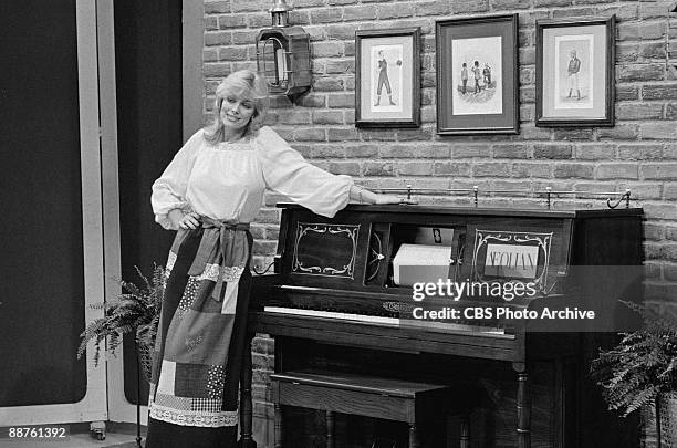 Model Dian Parkinson shows off one of the prizes, a piano, on the game show 'The Price Is Right', February 1978.
