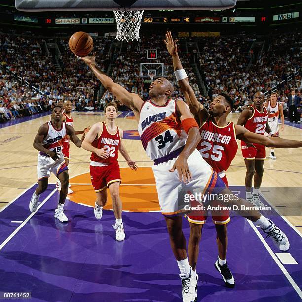 Charles Barkley of the Phoenix Suns shoots a layup against Robert Horry of the Houston Rockets in Game Five of the Western Conference Semifinals...
