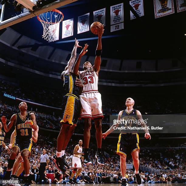 Scottie Pippen of the Chicago Bulls shoots a layup against the Indiana Pacers in Game Two of the Eastern Conference Finals during the 1998 NBA...